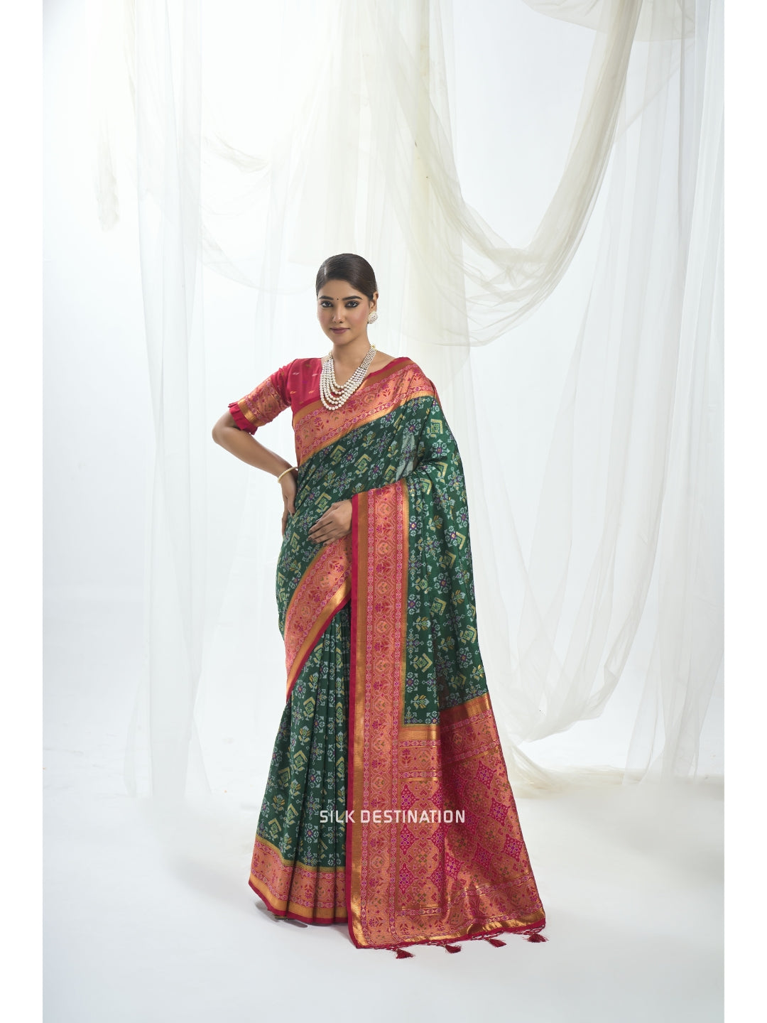 Rajyashri Saree: Godly Green with Radiant Red Pallu, double Ikat patola Silk Saree